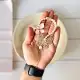 گیر گوجه‌ای فلزی طرح پروانه تزیینی زنجیردار